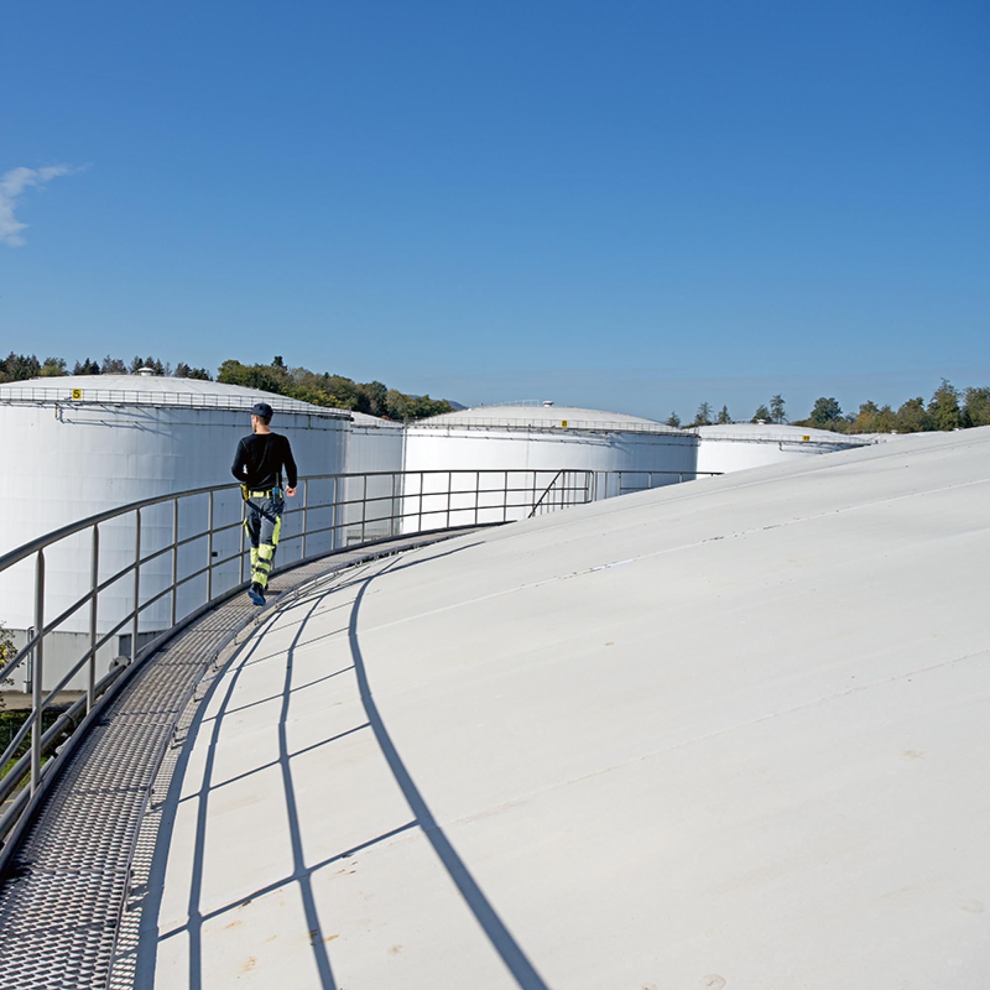 The photo shows three round tanks which are about 50 meters high.
